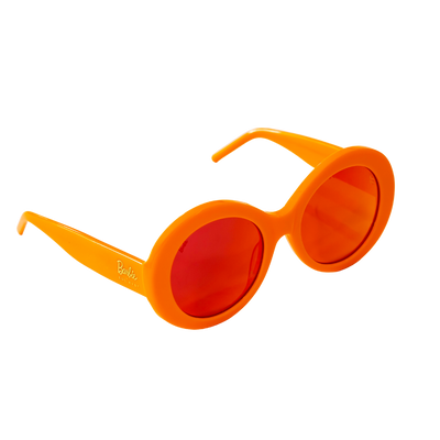 Barbie Sol Kyst round orange sunglasses with red-tinted lenses, shown at an angled view.
