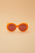 Barbie Sol Kyst women's round sunglasses with orange frames and pink tinted lenses - front view.