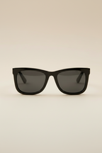 Sol Kyst women's square sunglasses with black frames and dark tinted lenses - front view.