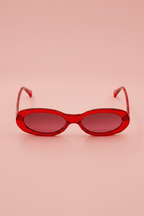 Barbie women's oval sunglasses with red frames and pink-tinted lenses - front view.