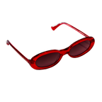 Side angle of Barbie x Sol Kyst oval sunglasses with tinted lenses and sleek red frame design