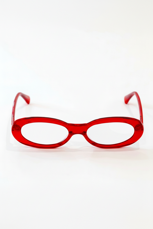 Red eyeglasses on a white background