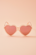 Peach-pink heart-shaped sunglasses with nylon lenses from the Barbie x Sol Kyst collection.