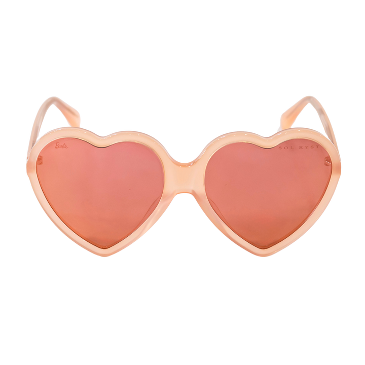 Peach-pink heart-shaped sunglasses with nylon lenses from the Barbie x Sol Kyst collection.