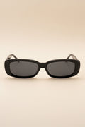 Black sunglasses with dark lenses on a white background