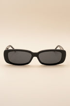 Black sunglasses with dark lenses on a white background