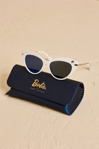 White Barbie cat eye sunglasses sitting on top of a matching "Barbie x SOL KYST" case.