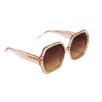 Angled view of Barbie x Sol Kyst brown hexagonal sunglasses with brown tinted lenses.