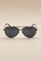Sol Kyst women's aviators with black frames and dark blue tinted lenses - front view.