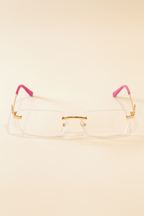 Eyeglasses with pink temple tips on a white background