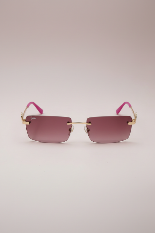 Barbie rimless sunglasses with pink tinted lenses, gold accents, and pink ear tips.