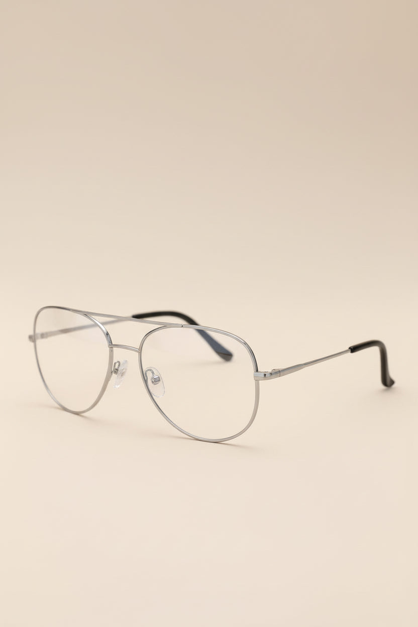 Aviator glasses on a beige background