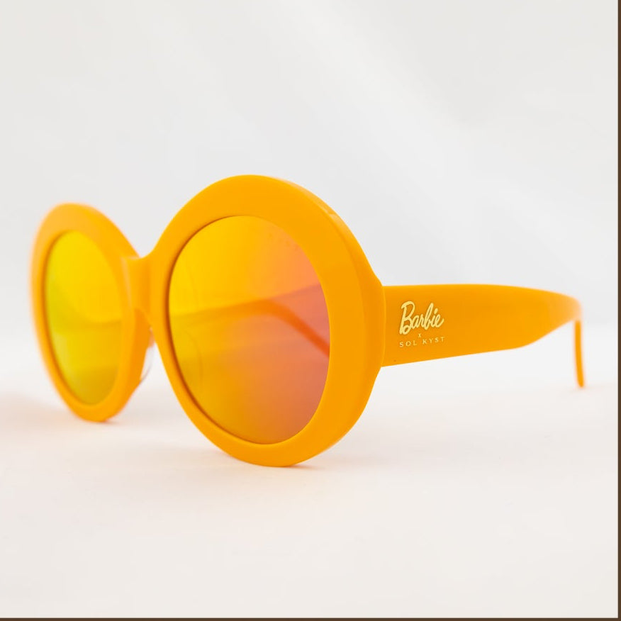 Four angles of Barbie Sol Kyst round orange sunglasses with tinted lenses, displayed against a white background.