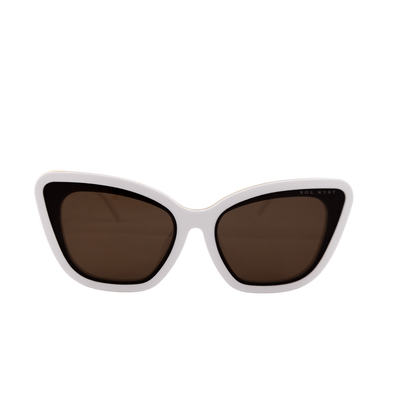 Close-up view of Sol Kyst Bridal Collection sunglasses featuring a white acetate frame and soft square cat-eye design with brown lenses.