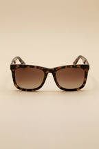Tortoise-patterned square sunglasses with gradient brown-tinted lenses, showcasing a bold and classic frame design.