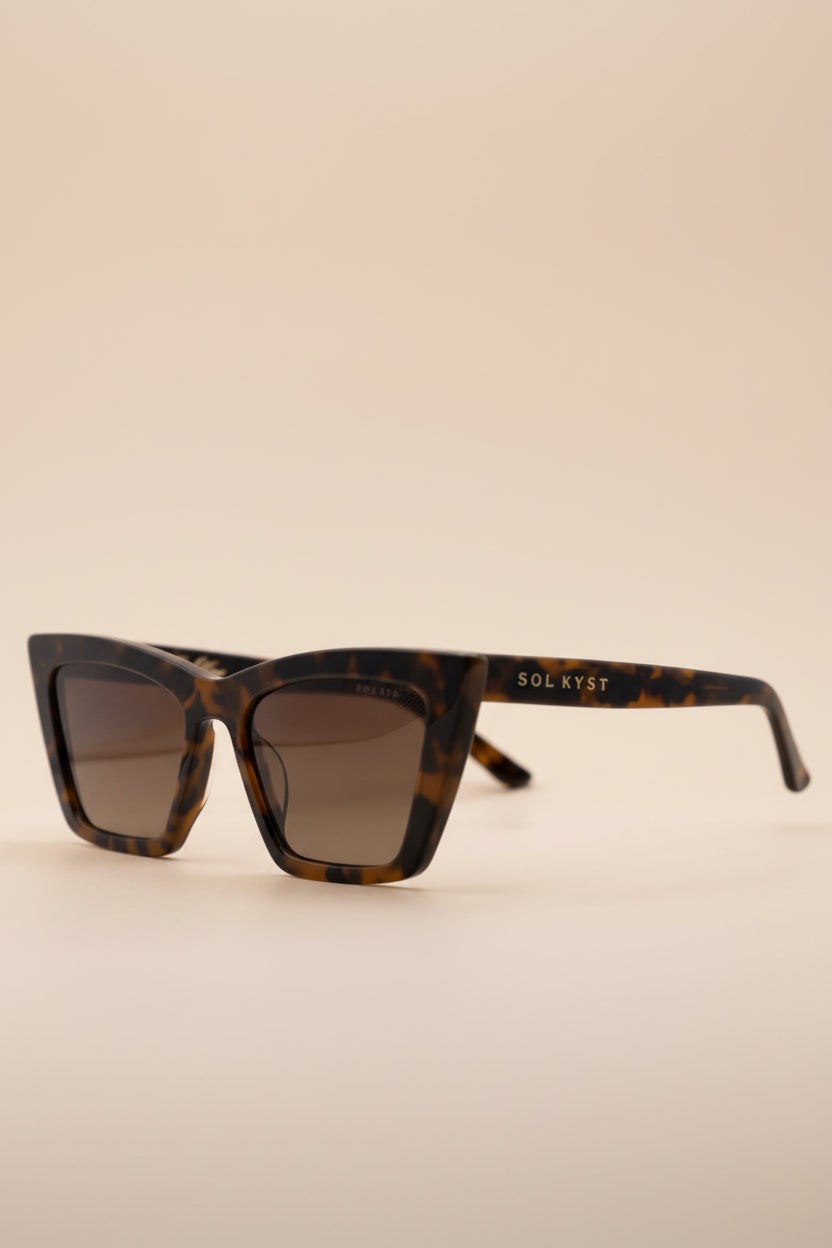 Four angles of women's trapezoid sunglasses with tortoise frame and gradient lenses.