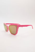 Pink sunglasses with gold lenses on a white background