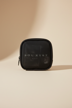 Front view of Sol Kyst "Kyst Kit" - small black mesh bag for holding sunglasses accessories.