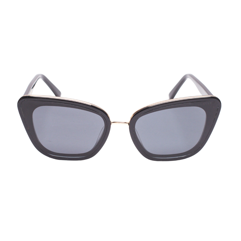 Front view of Sol Kyst women's cat eye sunglasses with black frames and gray-tinted lenses.