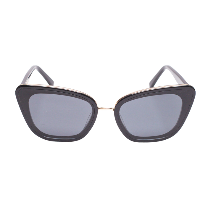 Front view of Sol Kyst women's cat eye sunglasses with black frames and gray-tinted lenses.