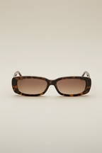 A pair of brown patterned sunglasses with a full frame design.
