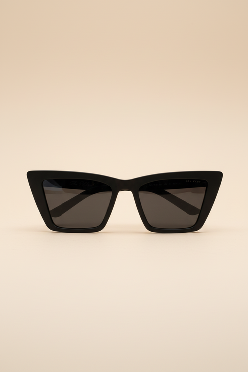 Black cat-eye sunglasses on a beige background