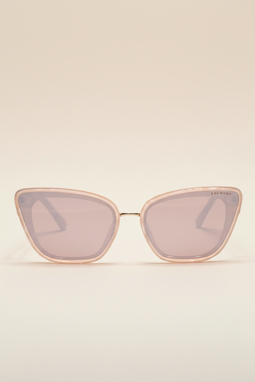 Beige Sol Kyst women's cat eye sunglasses featuring light pink-tinted lenses, shown in a front view.
