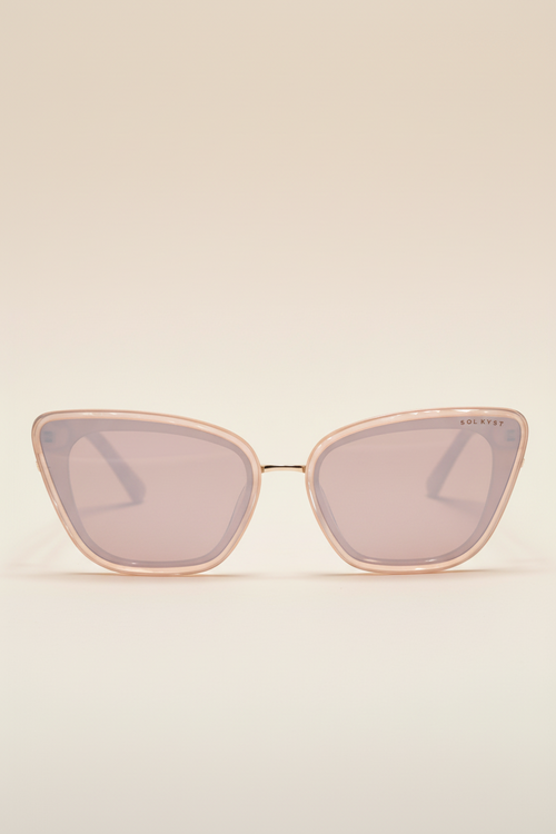 Beige Sol Kyst women's cat eye sunglasses featuring light pink-tinted lenses, shown in a front view.